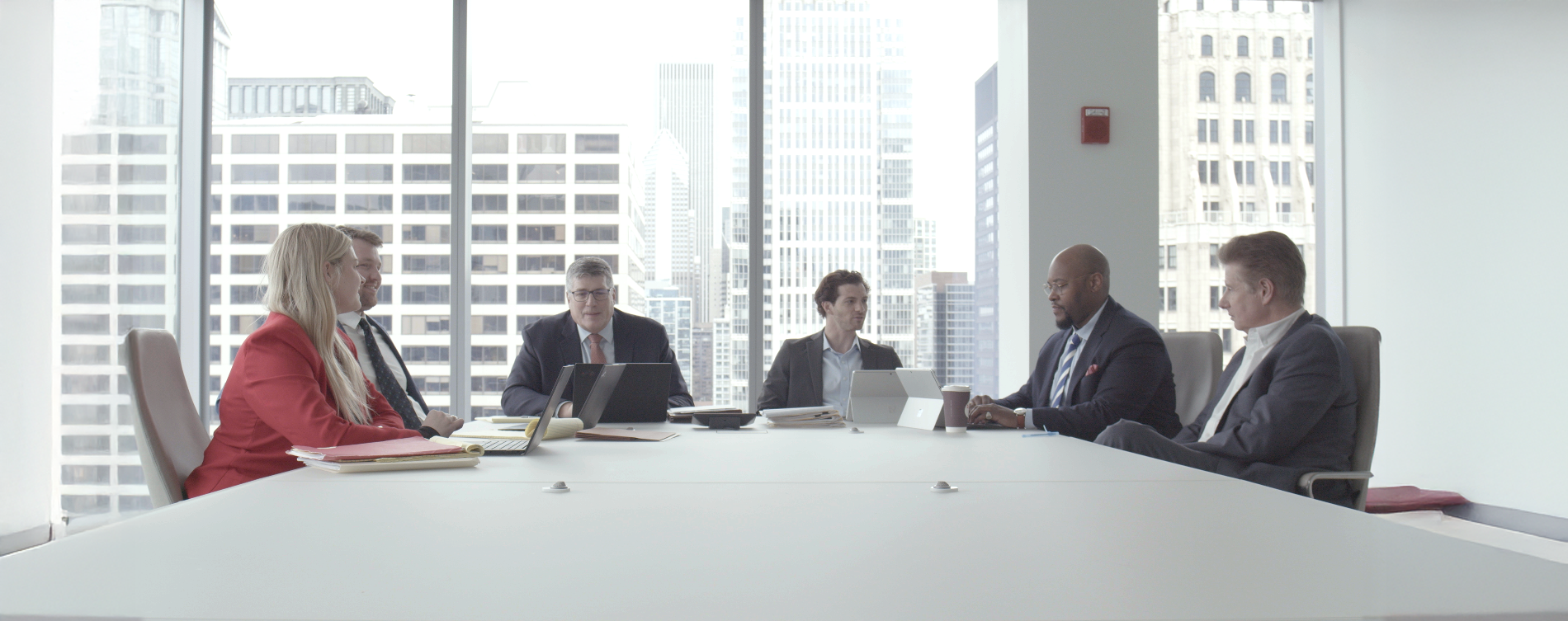Hinshaw conference room photo with attorneys collaborating.