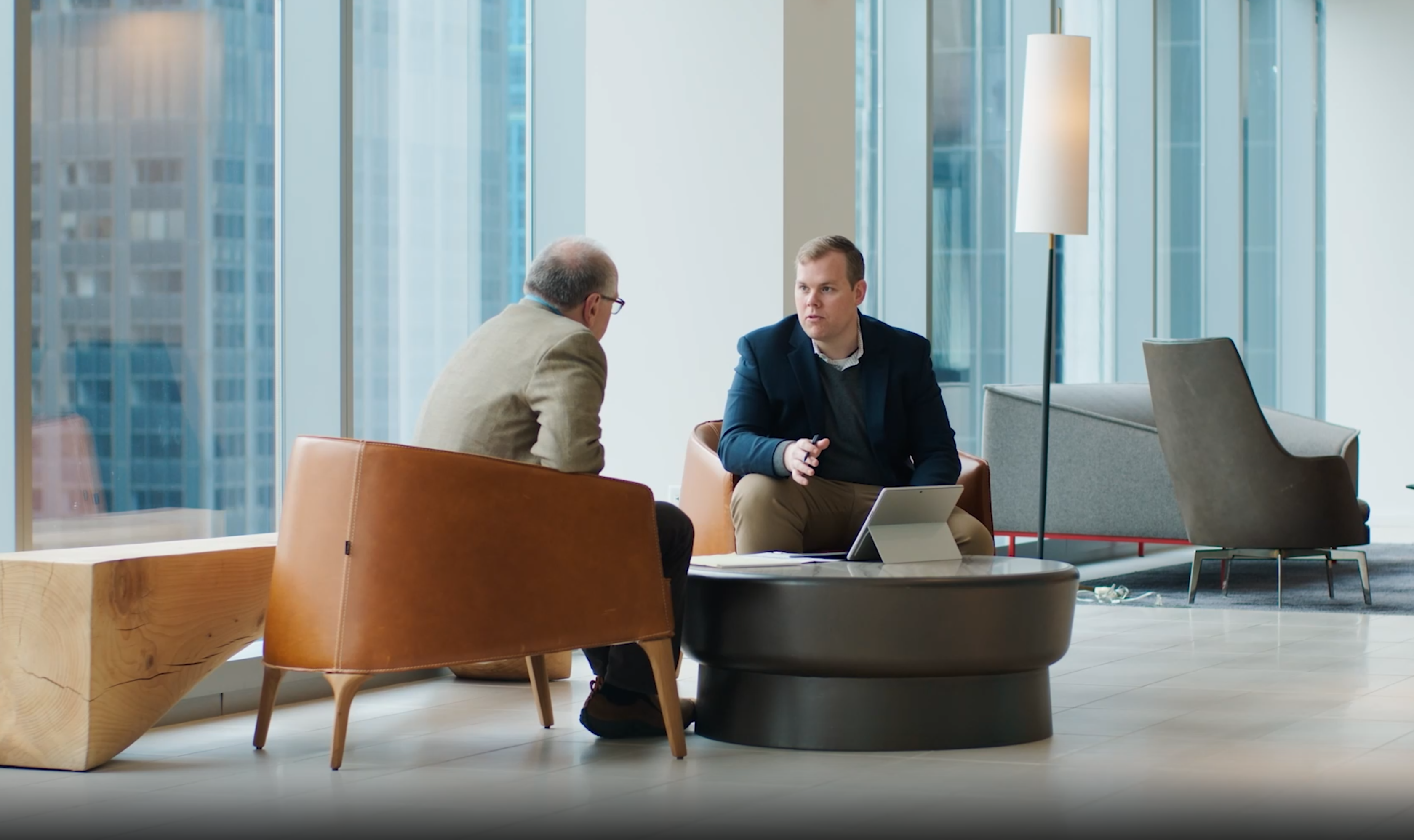 Josh Vincent and Bill cook conversation in reception.