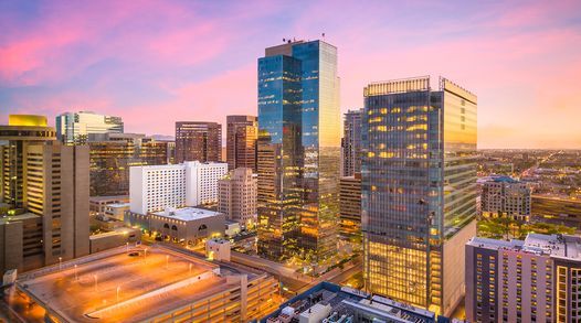 Phoenix business district skyline with skyscrapers at dusk.