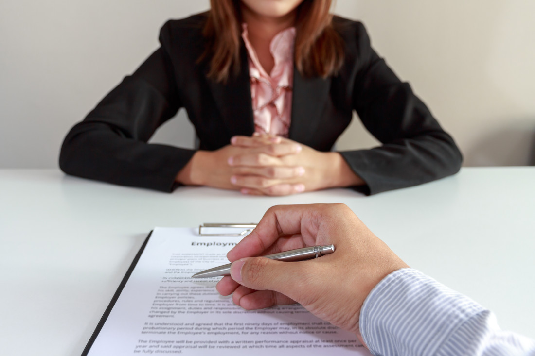 employee signing a contract