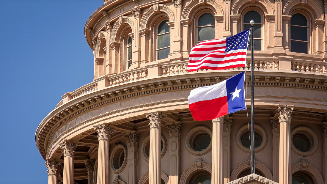 State Capitol in Texas with American and Texas Flags