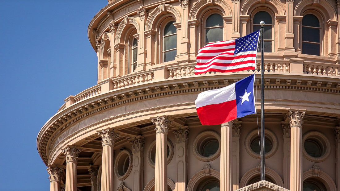 State Capitol in Texas with American and Texas Flags