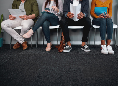 Job Applicants Sitting on Chairs - Hinshaw - New York Expands Anti-Discrimination Laws for Nonresident Job Seekers